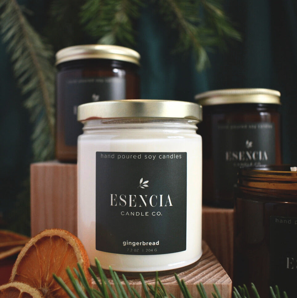 Esecncia Candle Co. gingerbread candle with other candles in the background